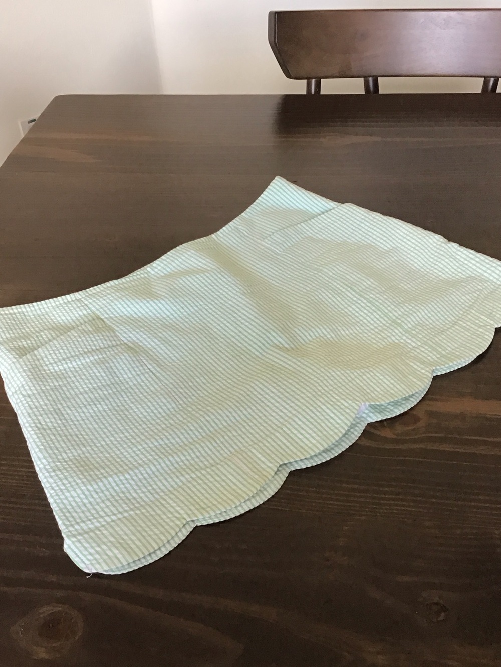 Lilly Pulitzer Colette Scallop Skort in a green and white seersucker fabric.